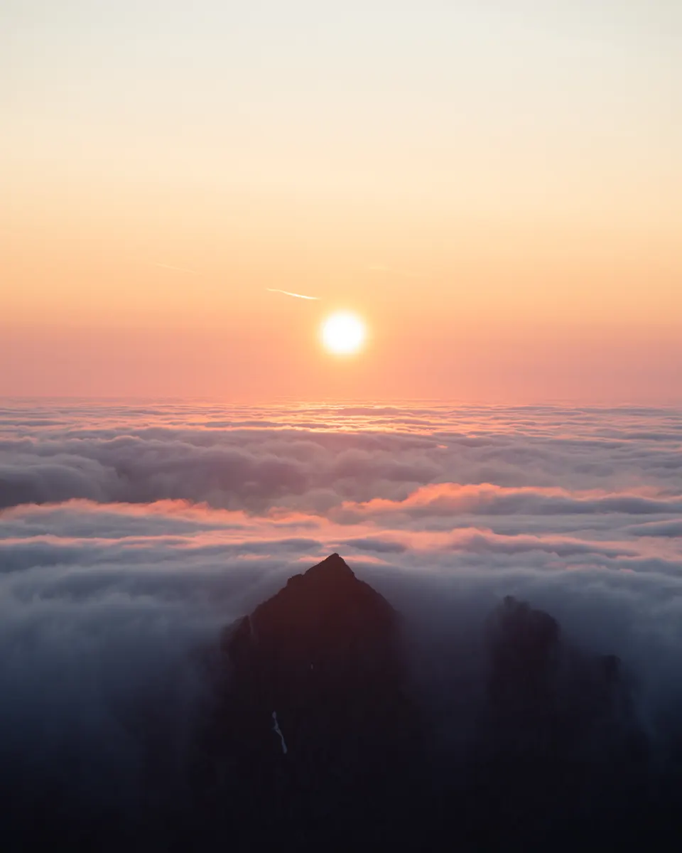 Before: the sun above a sea of clouds
