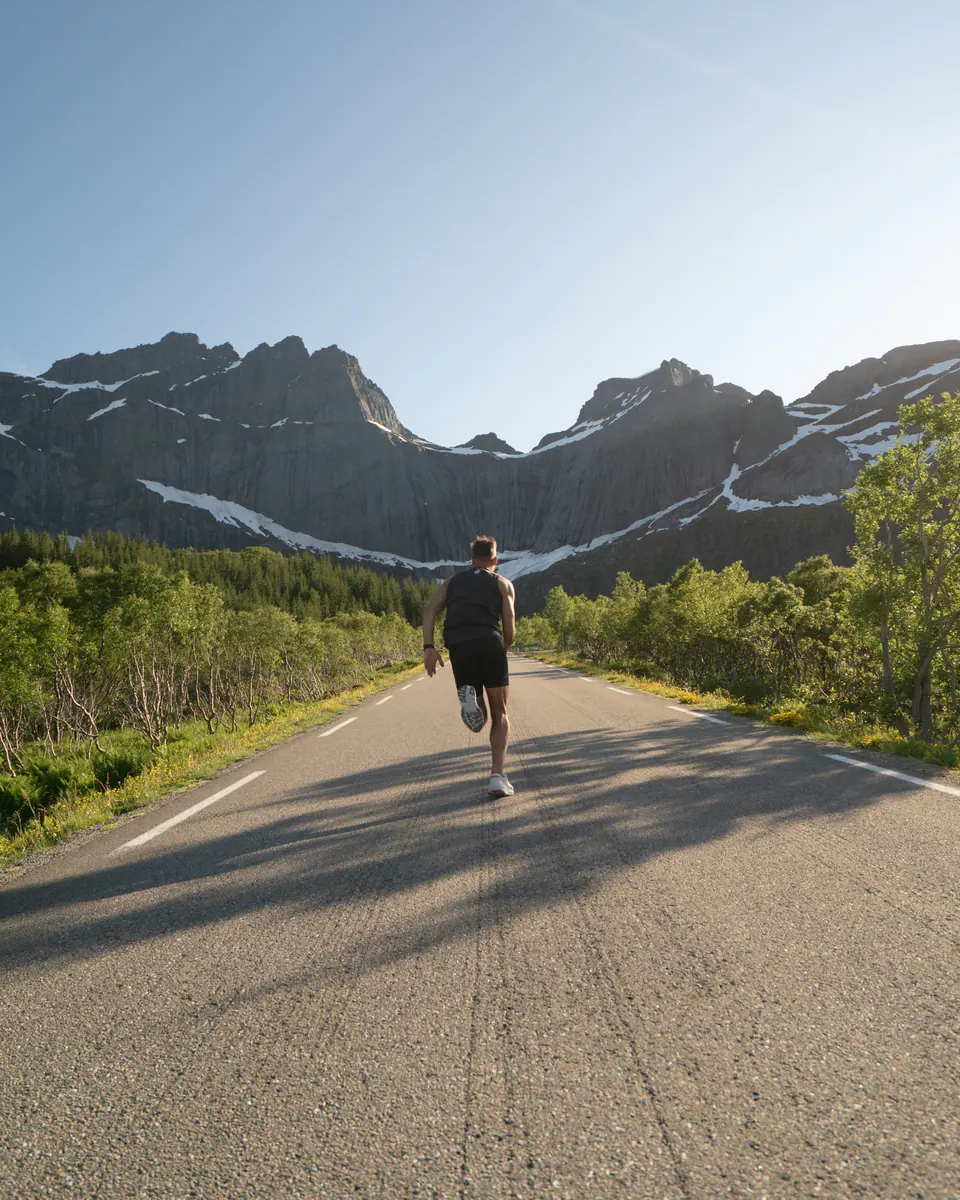 Before: a runner on an empty mountain road